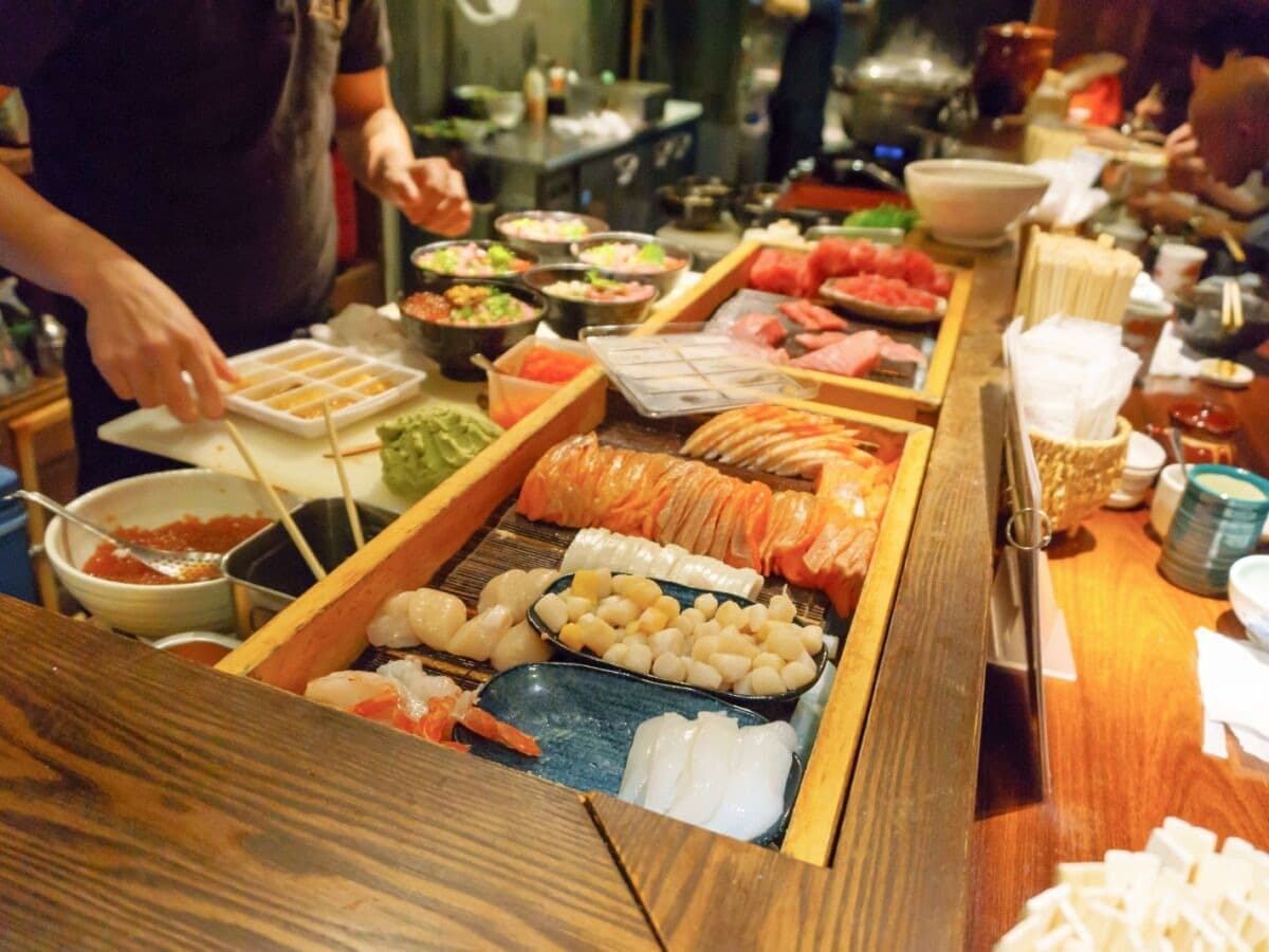 Sushi ingredients and prepared dishes at a Tokyo restaurant counter