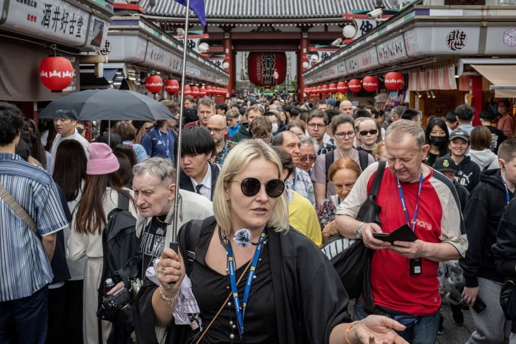 Crowded Japanese food street with many travelers and restaurant stalls