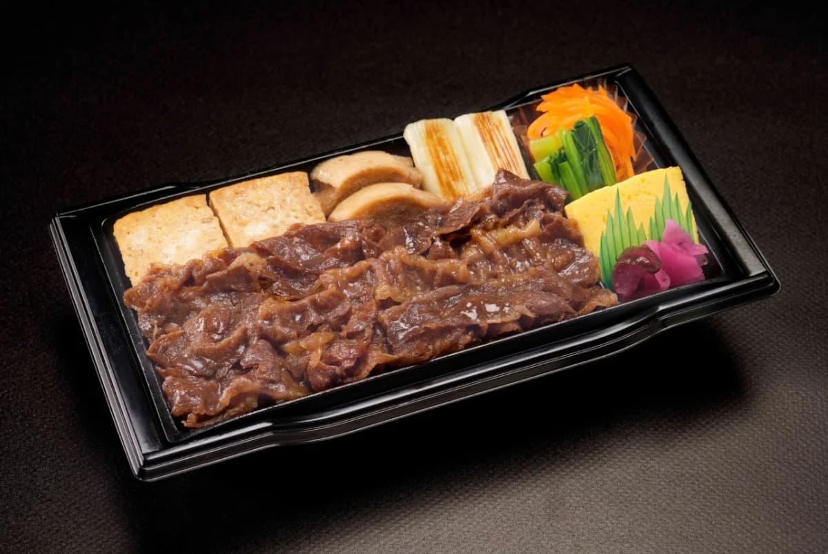 Prepared wagyu beef meal with tofu, vegetables, and side dishes