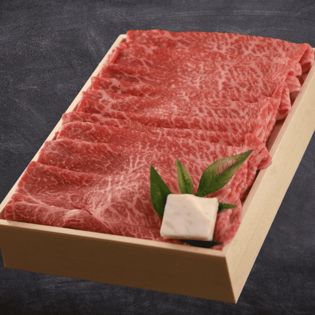 Tray of thinly sliced marbled wagyu beef prepared for cooking